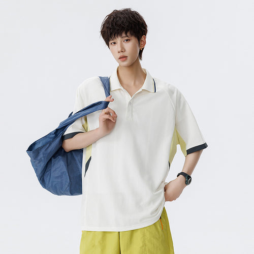 Unisex Boxy Oversize Polo-Shirt aus technischem Funktionsjersey mit Kontrastpaneelen und Raglanärmeln Drune