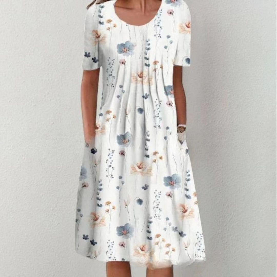 Damen Plissee Midi Kleid mit kurzen Ärmeln, seitlichen Taschen und floralem Saum Drune