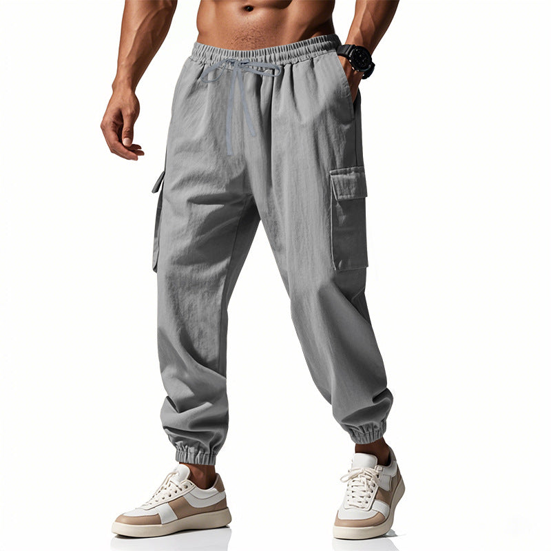 Herren nan konisch zulaufende Jogger im utilitarischen Stil mit elastischem Bund, Kordelzug und Klappentaschen Drune
