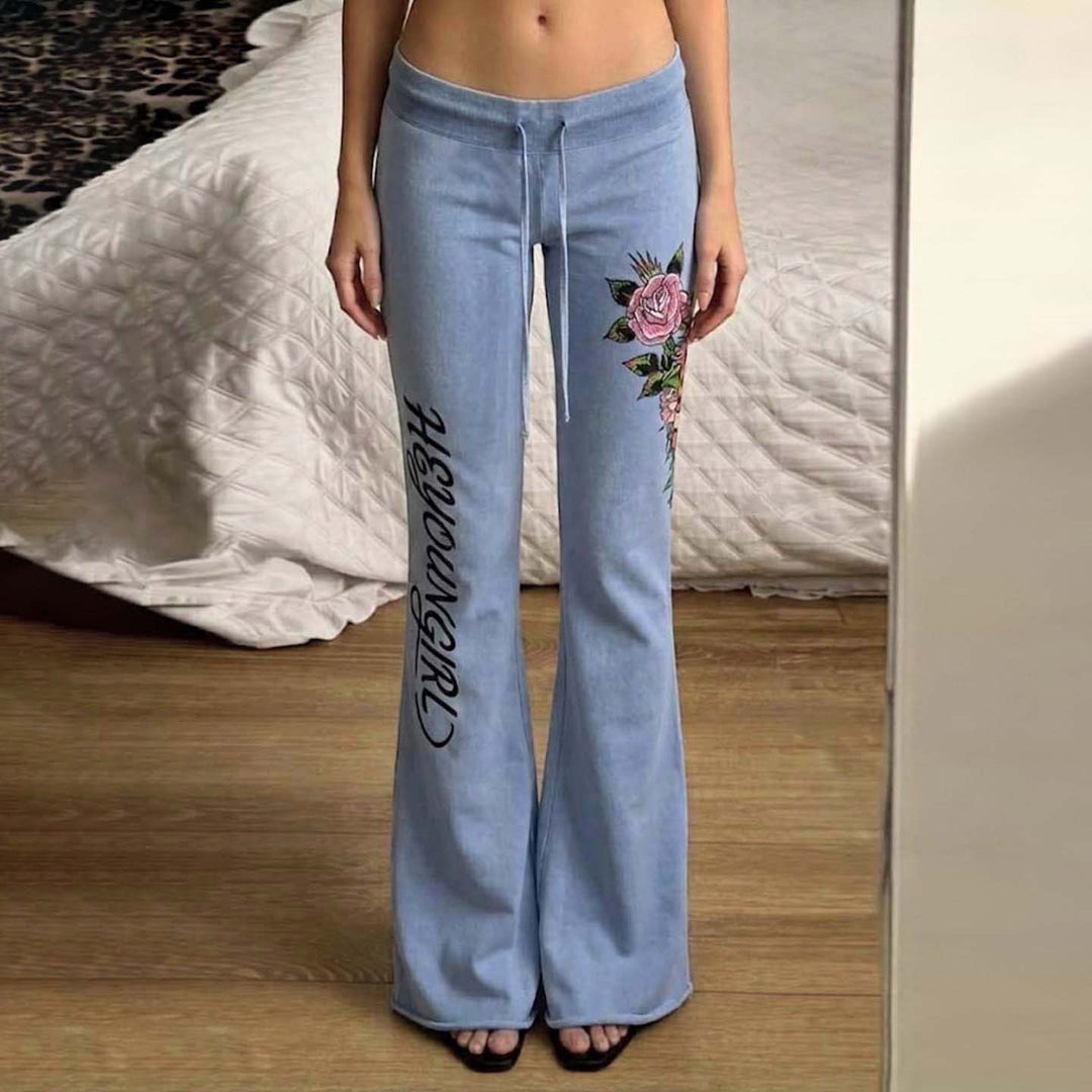 Damen nan ausgestellte Jersey-Sweathose mit Kordelzug, floralem Seitenprint und Statement-Schriftzug Drune