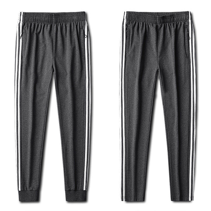 Herren Slim-Fit Trackhose mit seitlichen Kontraststreifen, Reißverschlusstaschen und elastischem Bund Drune