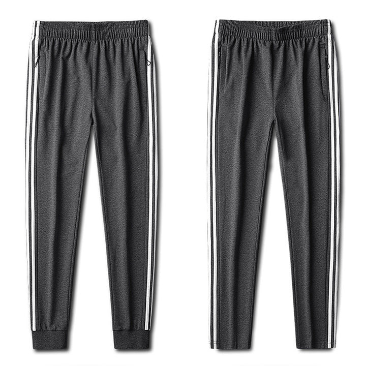 Herren Slim-Fit Trackhose mit seitlichen Kontraststreifen, Reißverschlusstaschen und elastischem Bund Drune