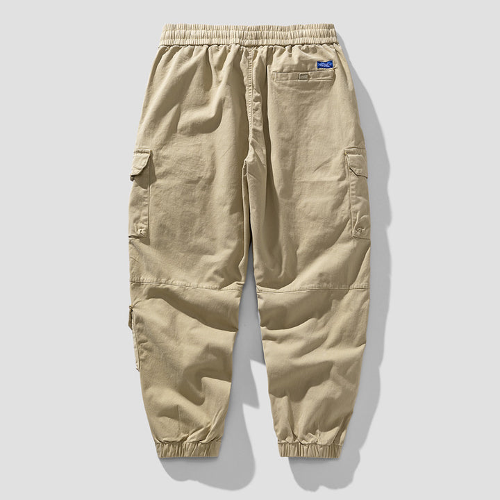 Herren Leichte Canvas-Cargohose im Joggerstil mit elastischem Bund, segmentierten Kniepaneelen und verdeckten Klappentaschen Drune