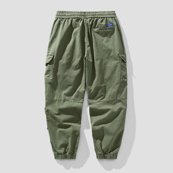 Herren Leichte Canvas-Cargohose im Joggerstil mit elastischem Bund, segmentierten Kniepaneelen und verdeckten Klappentaschen Drune