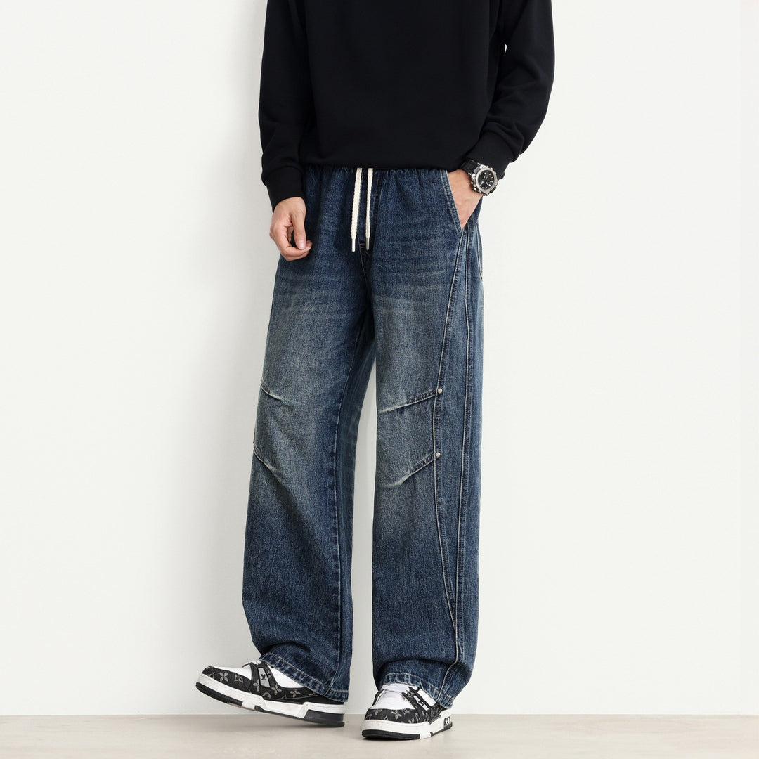Herren Weite Denim-Hose mit Tunnelzugbund, Paneelnähten und Used-Waschung Drune