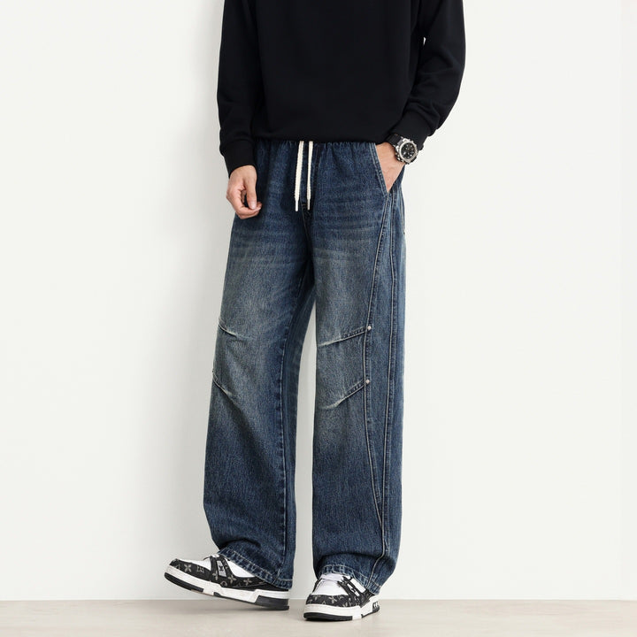 Herren Weite Denim-Hose mit Tunnelzugbund, Paneelnähten und Used-Waschung Drune