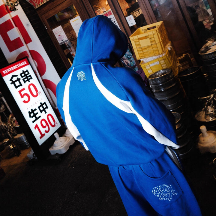 Damen nan verkürzte Joggerhose mit elastischem Komfortbund, seitlichen Kontrast-Taschen und verstellbarer Saumkordel Drune