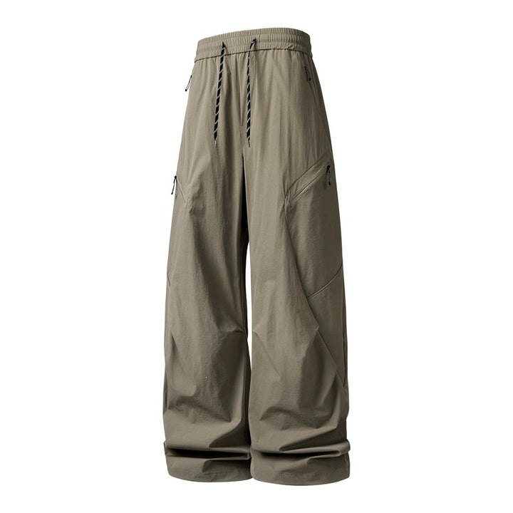 Herren Oversize-Utility-Cargo-Hose aus leichtem Nylon mit elastischem Kordbund, seitlichen Reißverschlusstaschen & weiter Ballon-Silhouette Drune