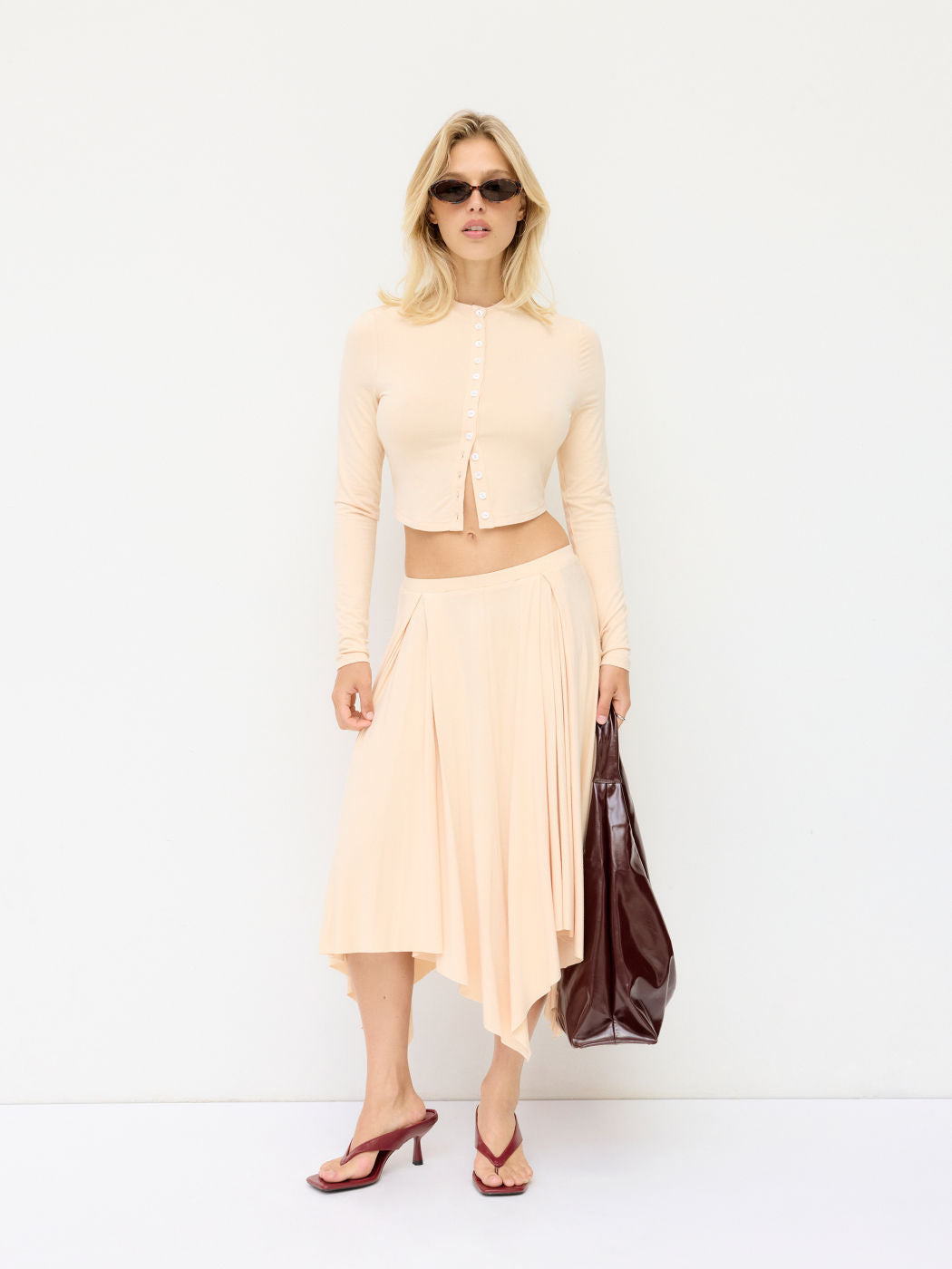 Damen Cropped-Cardigan mit Perlmuttknöpfen und asymmetrischem Zipfel-Midirock Drune