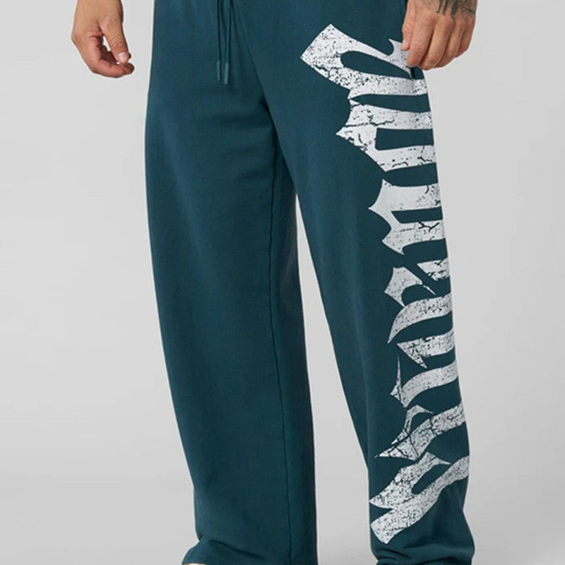 Herren nan weite Sweathose aus angerautem Fleece mit seitlichem Vintage-Print und Kordelbund Drune