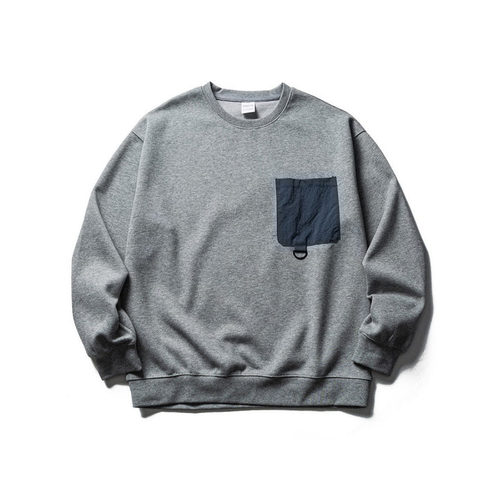 Unisex Oversize-Sweatshirt mit kontrastierender Brusttasche und D-Ring Drune