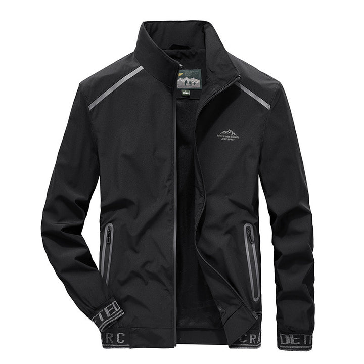 Herren Softshelljacke mit reflektierenden Einsätzen, wasserabweisenden Reißverschlusstaschen und hohem Stehkragen Drune