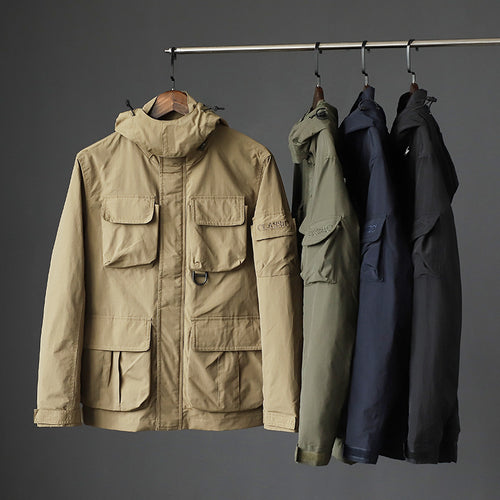 Herren urbane Feldjacke mit Mehrfach‑Taschen, windabweisender Oberfläche und verdeckter Kapuze Drune