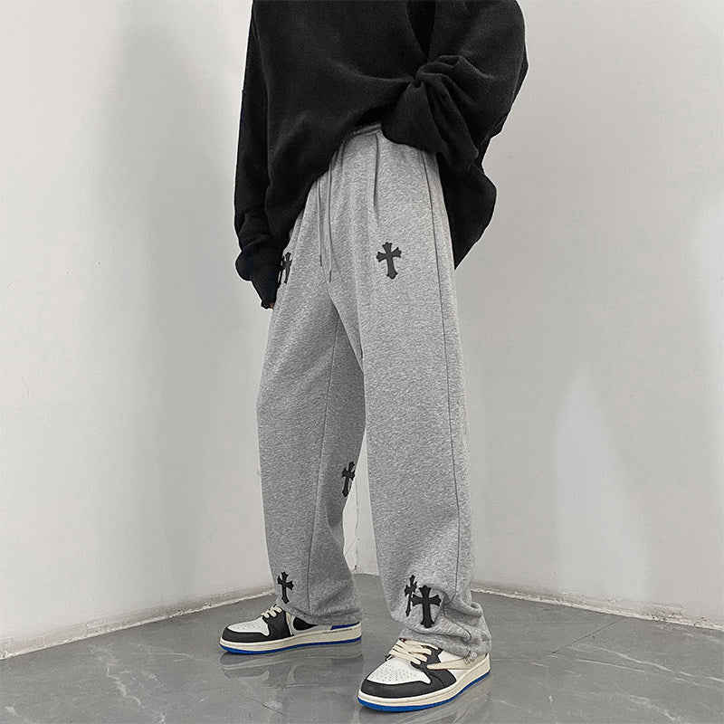 Herren weite Baumwoll-Jogginghose mit Allover-Kreuzprint und elastischem Tunnelzugbund Drune