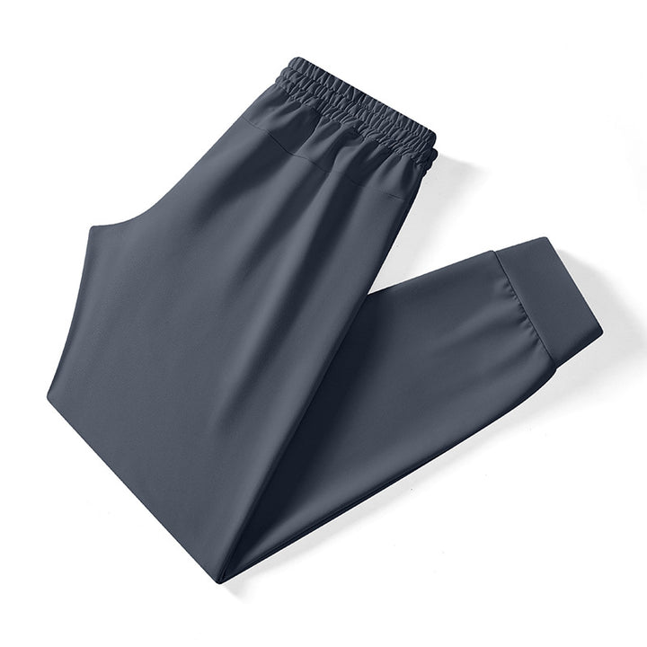 Herren athletische Tech-Jogginghose mit elastischem Kordelbund, verdeckten Reißverschlusstaschen und formgebenden Knöchelbündchen Drune