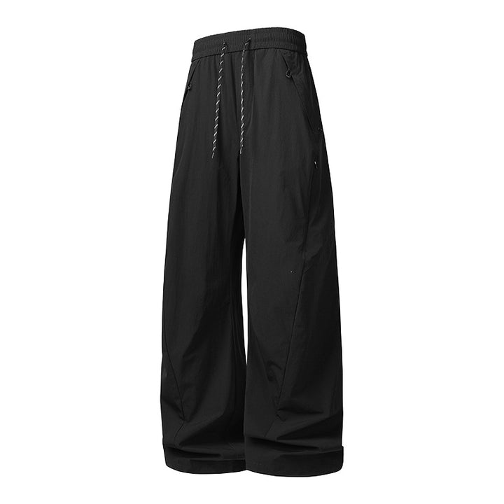 Unisex Weite Tech-Baggy-Hose mit elastischem Kordbund, Reißverschlusstaschen & wasserabweisender Nylonoptik Drune