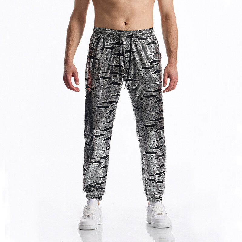 Herren Glänzende Jogginghose mit Tunnelzug, schmal zulaufendem Bein und abstraktem Print Drune