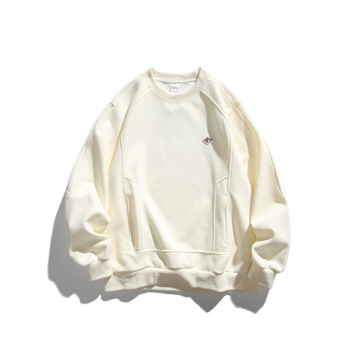 Unisex Oversize-Sweatshirt aus French-Terry mit Raglanärmeln, verdeckten Eingrifftaschen und kleinem Logopatch Drune