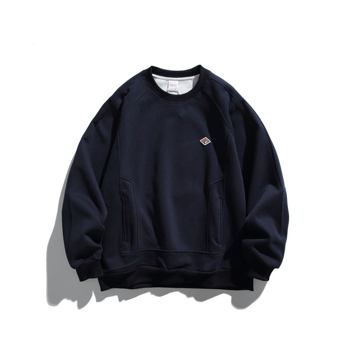 Unisex Oversize-Sweatshirt aus French-Terry mit Raglanärmeln, verdeckten Eingrifftaschen und kleinem Logopatch Drune