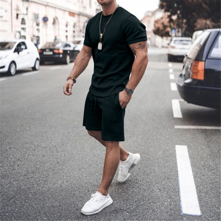 Herren nan figurbetontes Kurzarmshirt mit verstärkter Schulternaht und elastischer Kordelzug-Bermuda aus Stretchjersey Drune