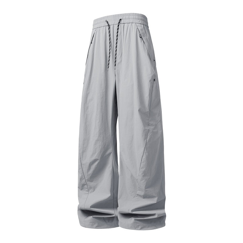 Unisex Weite Tech-Baggy-Hose mit elastischem Kordbund, Reißverschlusstaschen & wasserabweisender Nylonoptik Drune
