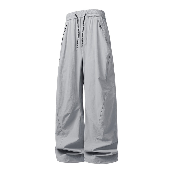 Unisex Weite Tech-Baggy-Hose mit elastischem Kordbund, Reißverschlusstaschen & wasserabweisender Nylonoptik Drune