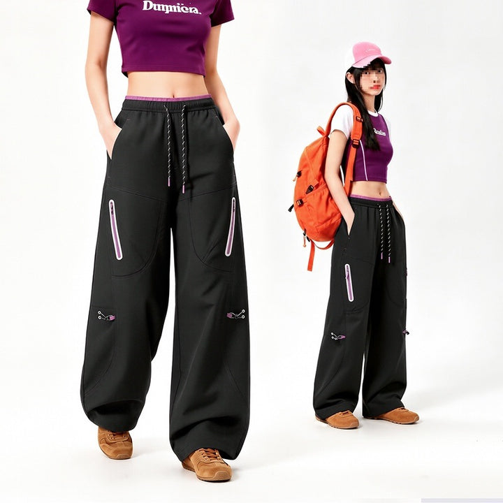 Damen Oversize Tech-Loungehose mit Kontrastnähten, reflektierenden Reißverschlusstaschen & Kordelbund Drune