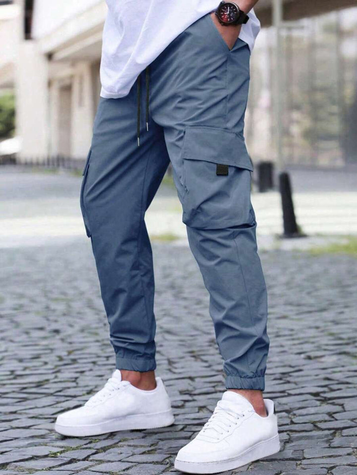 Herren technische Travel-Joggerhose mit integriertem Sicherheitsfach elastischem Tunnelzugbund und wasserabweisender Beschichtung Drune