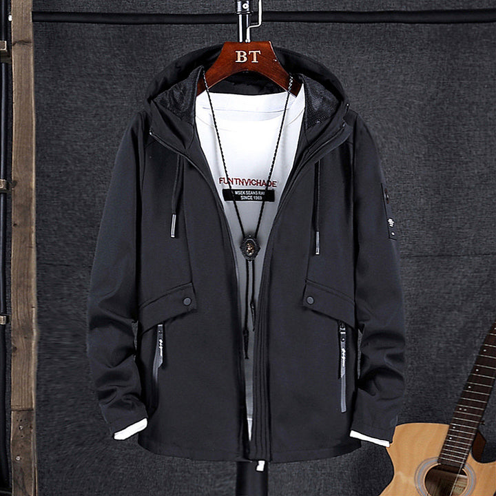 Herren Softshell-Fieldblouson mit Kapuze, verdecktem Zwei-Wege-Reißverschluss und multiplen Utility-Taschen Drune