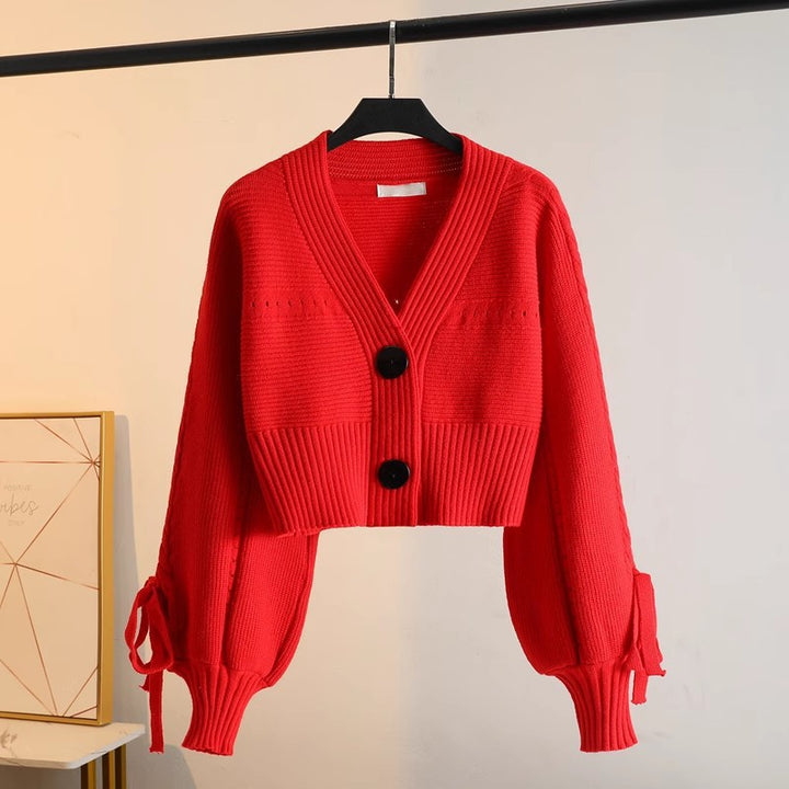 Damen modische Strickjacke mit voluminösen Ärmeln und Knopfdetails Drune