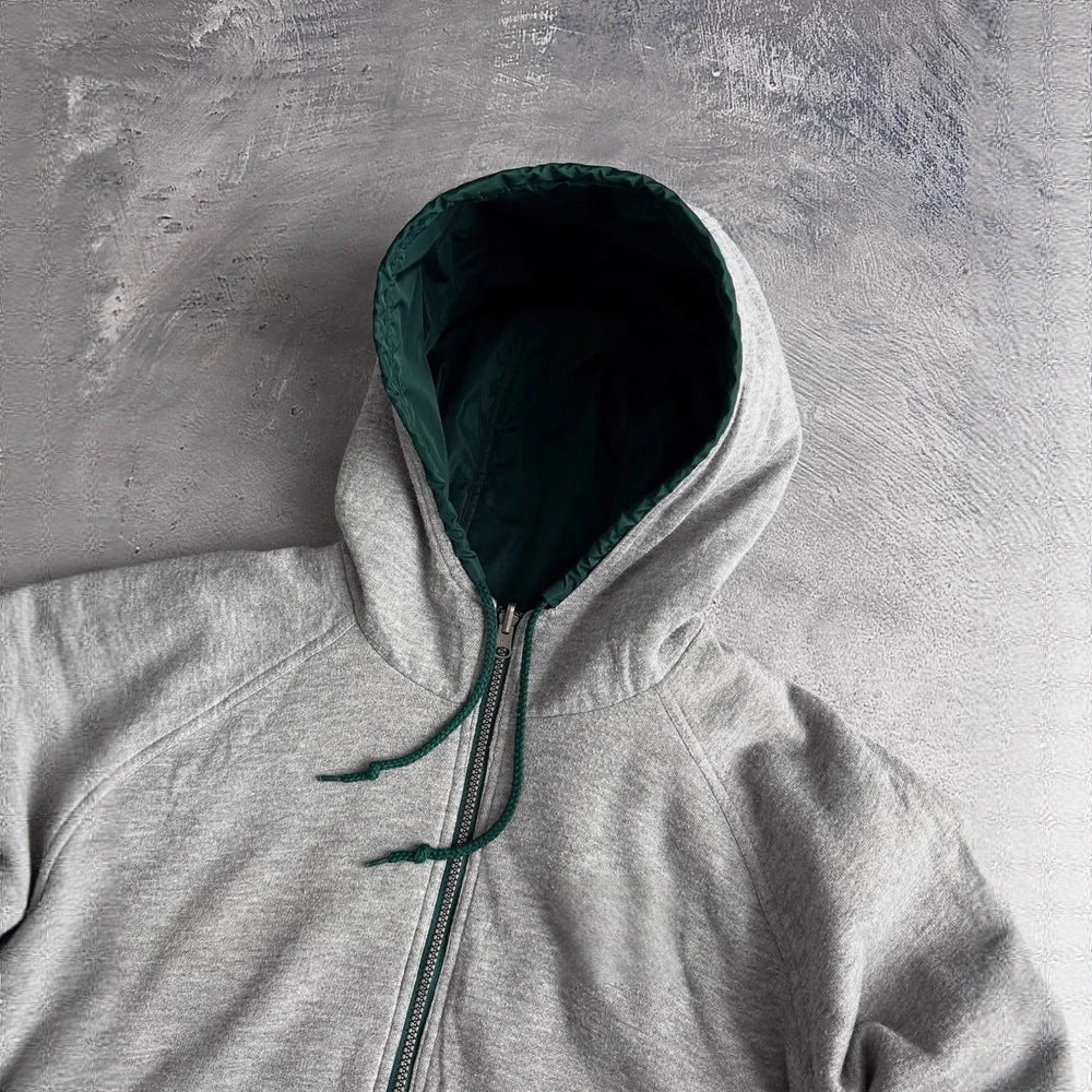 Unisex nan weit geschnittene Windjacke mit Kapuze wattiertem Fleeceinnenfutter Tunnelzugsaum und Zierstreifen an Ärmeln Drune
