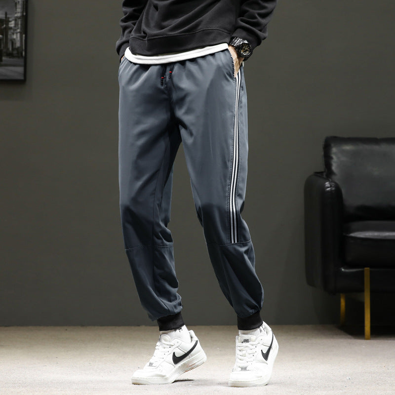 Herren Sportliche Nylon-Joggerhose mit elastischem Bund und seitlichen Kontraststreifen Drune