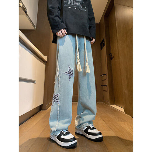Damen Weite High‑Waist Denimhose mit Stern‑Applikationen, Fransen‑Seitenschlitzen und Kordelbund Drune
