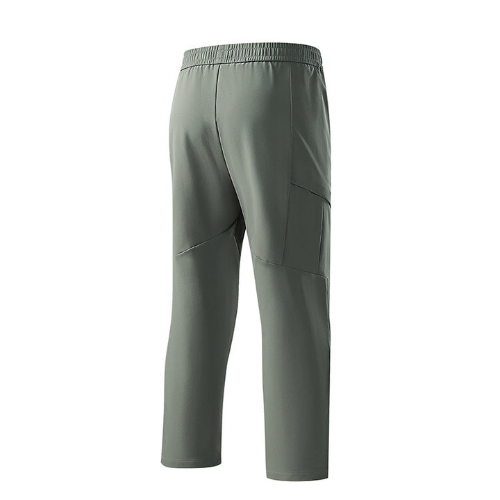 Herren Technische tapered Trainingshose mit elastischem Bund, 4‑Wege‑Stretch und Reißverschlusstaschen Drune