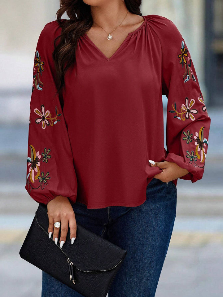 Damen Locker sitzende V-Ausschnitt Bluse mit floraler Stickerei an Ballonärmeln Drune