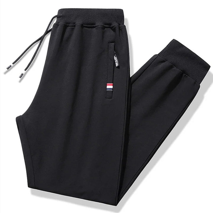 Herren Tapered-Jogginghose mit Tunnelzug, Reißverschlusstasche & Rippbündchen Drune