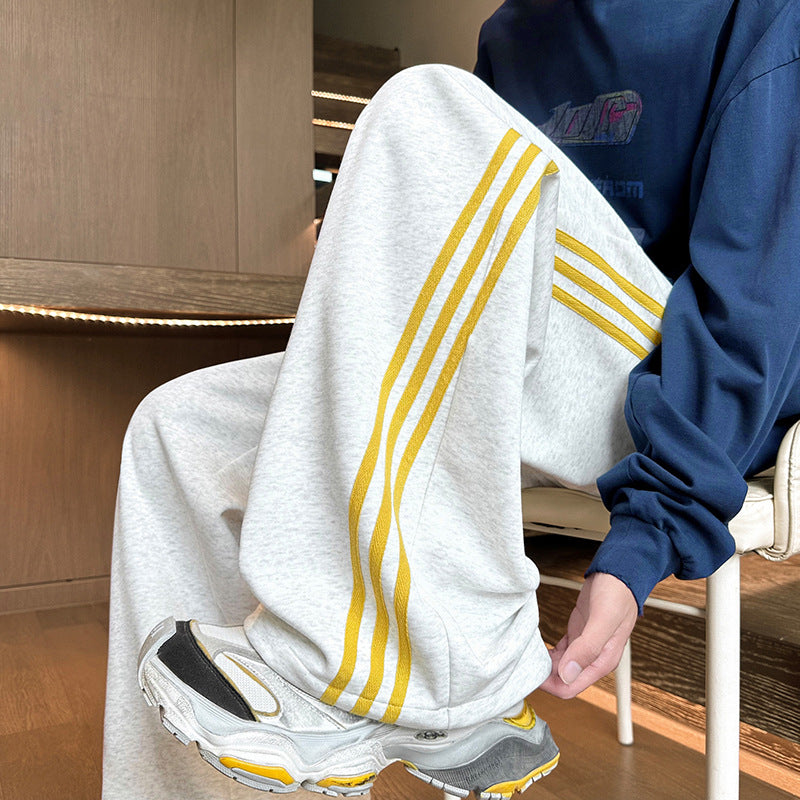 Herren Weitgeschnittene Trainingshose mit seitlichen Streifen Drune