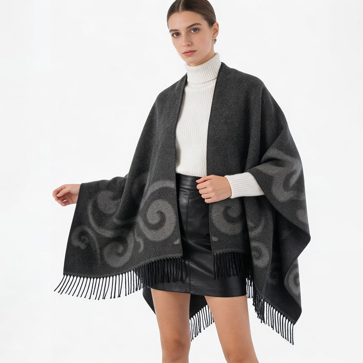 Damen Wollmix-Poncho mit Jacquard‑Wirbelmuster, V-Ausschnitt und Fransen Drune