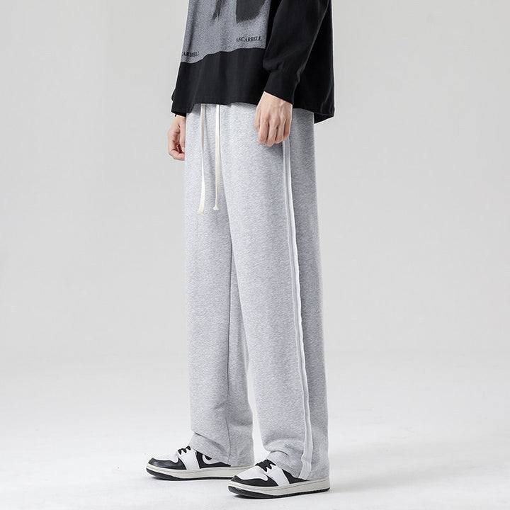 Herren weite Jogginghose im Oversize-Schnitt mit Seitenstreifen, Kordelzug & Fleecefutter Drune
