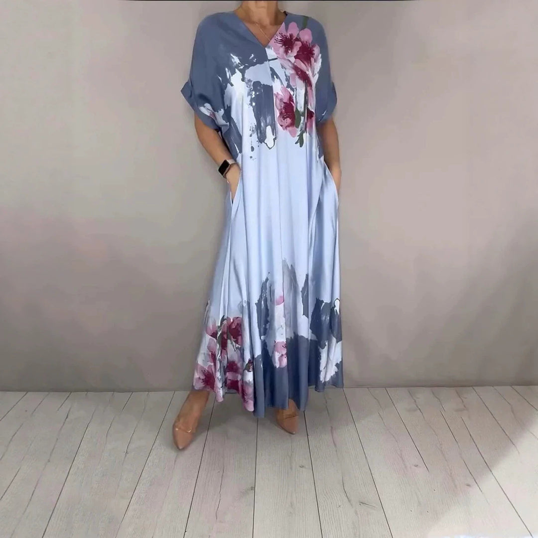 Damen Maxikleid mit weitem Fall, V-Ausschnitt, Eingrifftaschen und floraler Aquarelloptik Drune