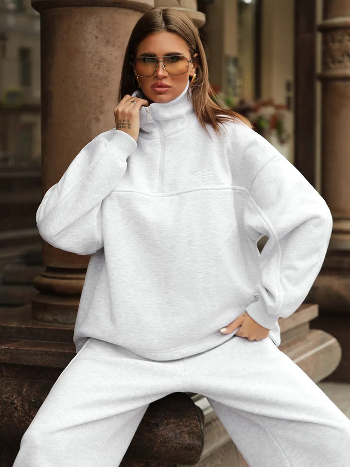 Damen cropped Sportanzug mit hohem Kragen und schmalem Reißverschluss Drune