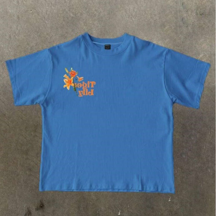 Damen T-Shirt mit künstlerischem floralem Druck und verspieltem Schriftzug Drune