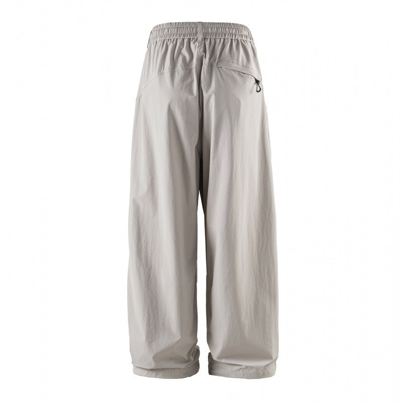 Unisex Weitgeschnittene technische Cargo-Hose mit Gummibund, Kordelzug und Reißverschlusstaschen Drune