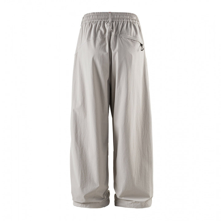Unisex Weitgeschnittene technische Cargo-Hose mit Gummibund, Kordelzug und Reißverschlusstaschen Drune