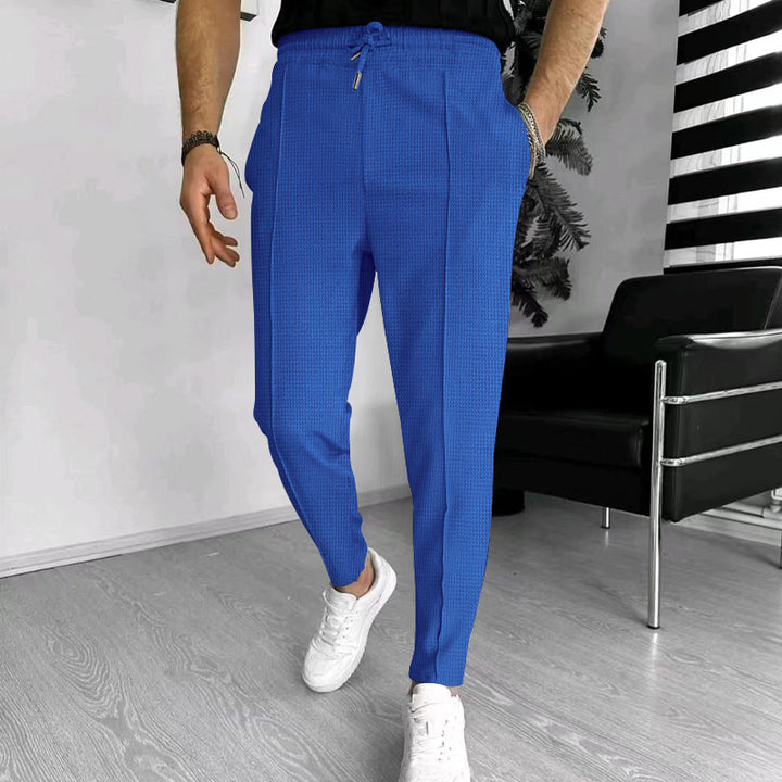 Herren nan schmal zulaufende Jogging-Chino aus strukturierter Webqualität mit elastischem Tunnelzugbund und dekorativer Bügelfalte Drune