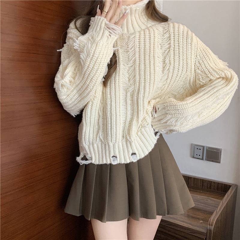 Damen Grobstrickpullover mit hohem Kragen und modernen Fransen Drune