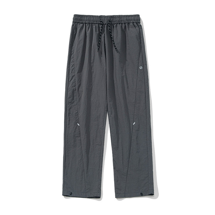Unisex Weite wasserabweisende Nylon-Freizeithose mit elastischem Bund und Druckknopf-Saum Drune