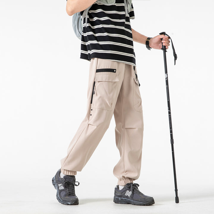 Herren weite Cargo-Jogginghose im Tech‑Utility‑Look mit elastischem Bund und multifunktionalen Klapptaschen Drune