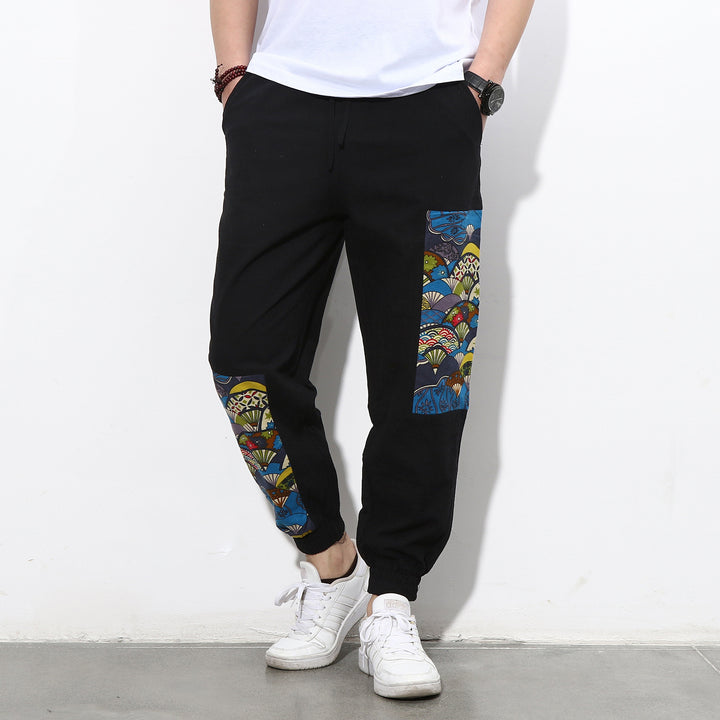 Herren Jogginghose mit seitlichen Panel-Prints, Tunnelzug und gerippten Bündchen Drune
