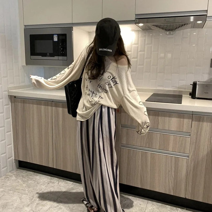 Damen lässiges Oversized-Oberteil mit off-Shoulder Design und künstlerischem Schriftzug Drune